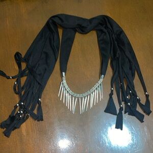 Black scarf with silver accessories
Doubles as a necklace